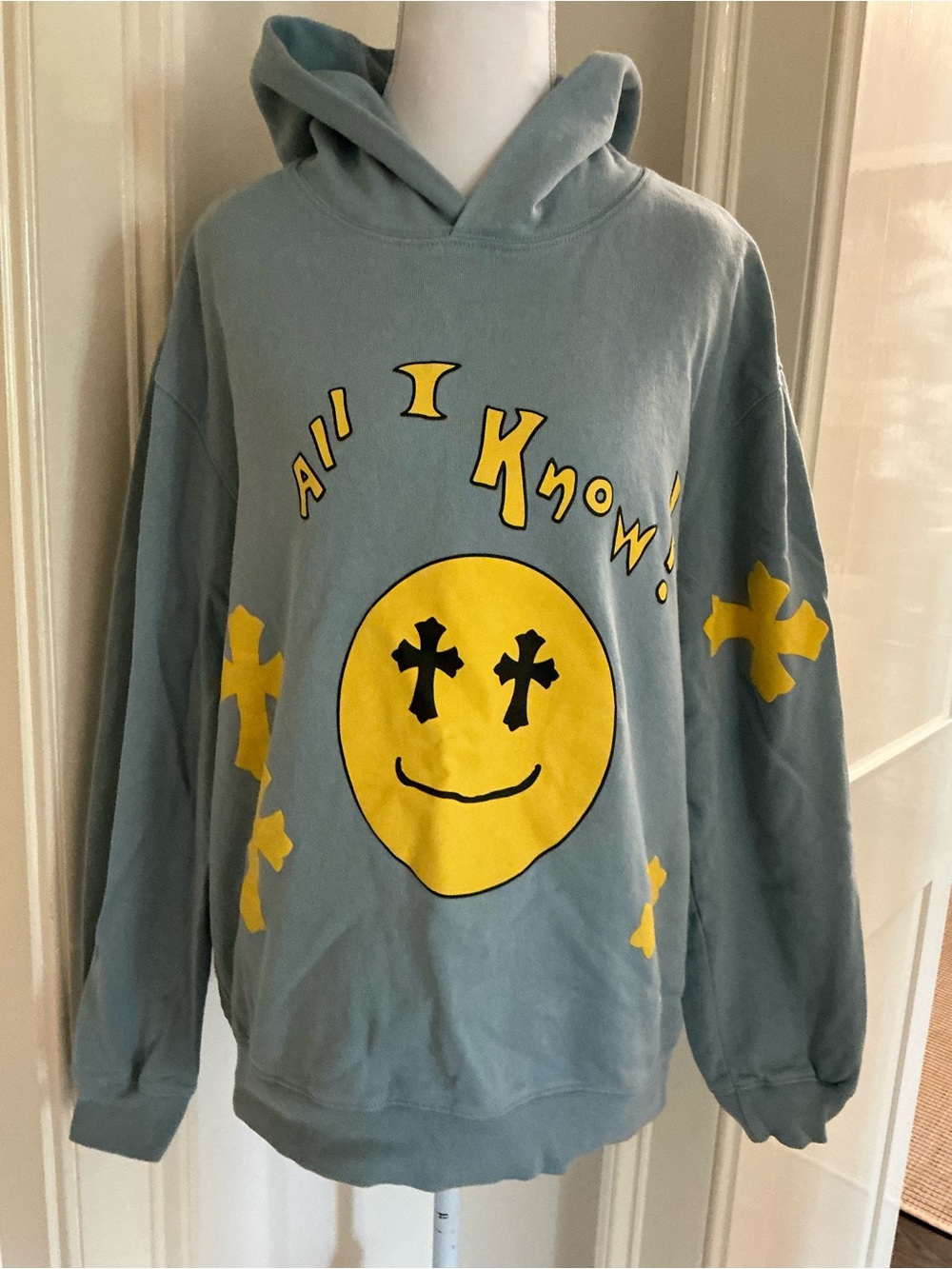 Blue Hoodie with Yellow Graphic Smiley and Crosses
